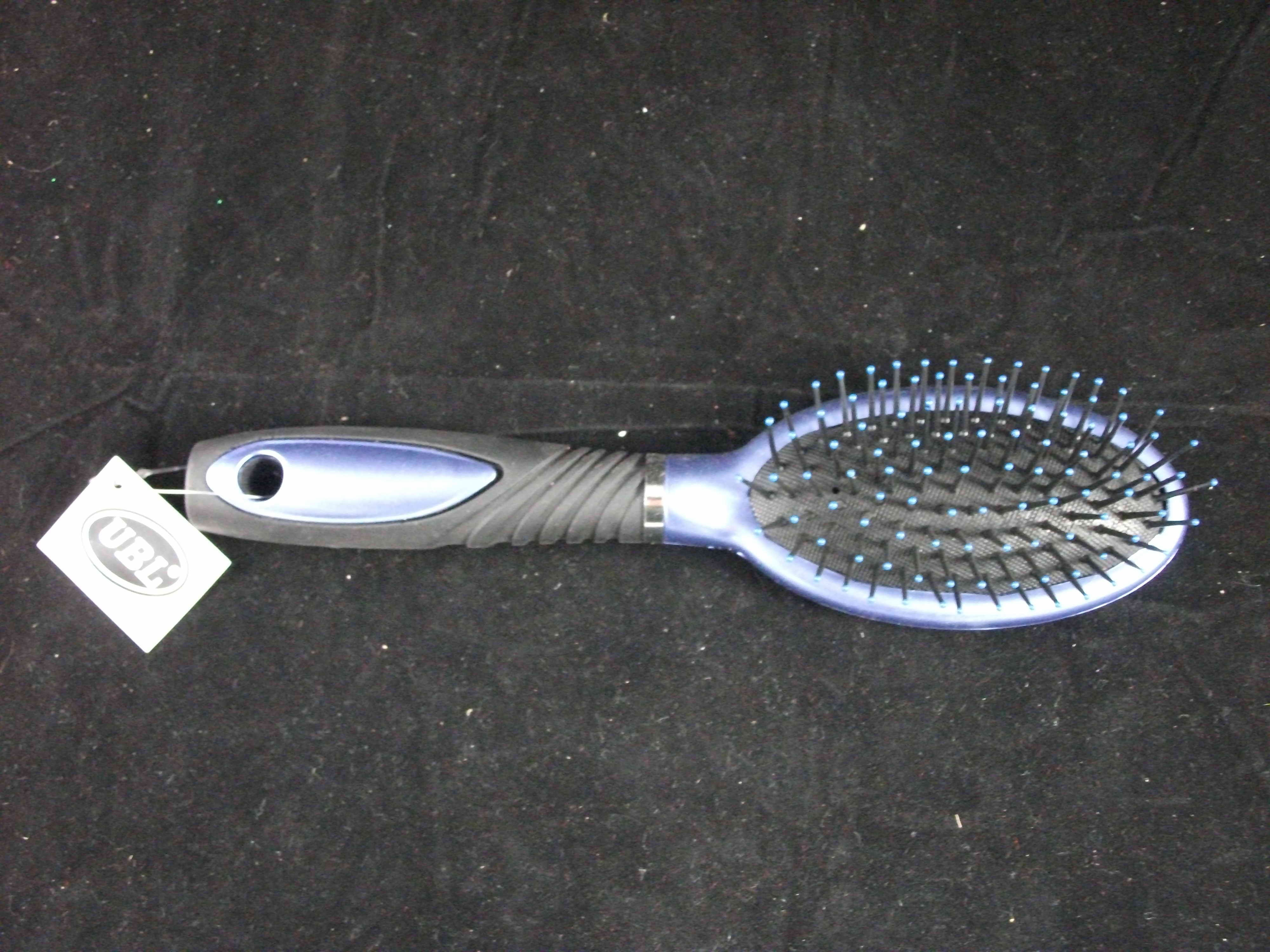 METALLIC HAIR BRUSH ON STAND