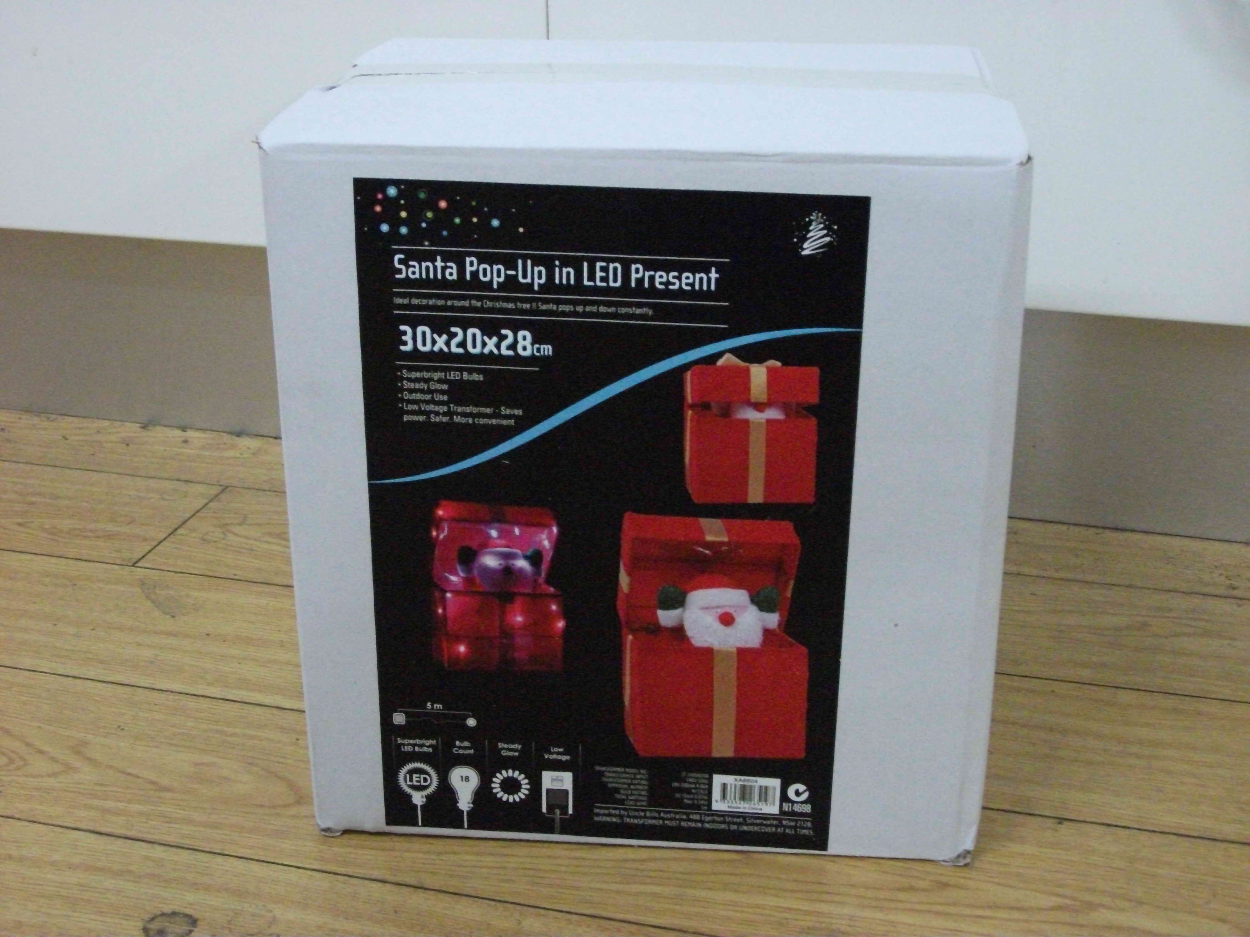 TINSEL SANTA POPUP PRESENT LED